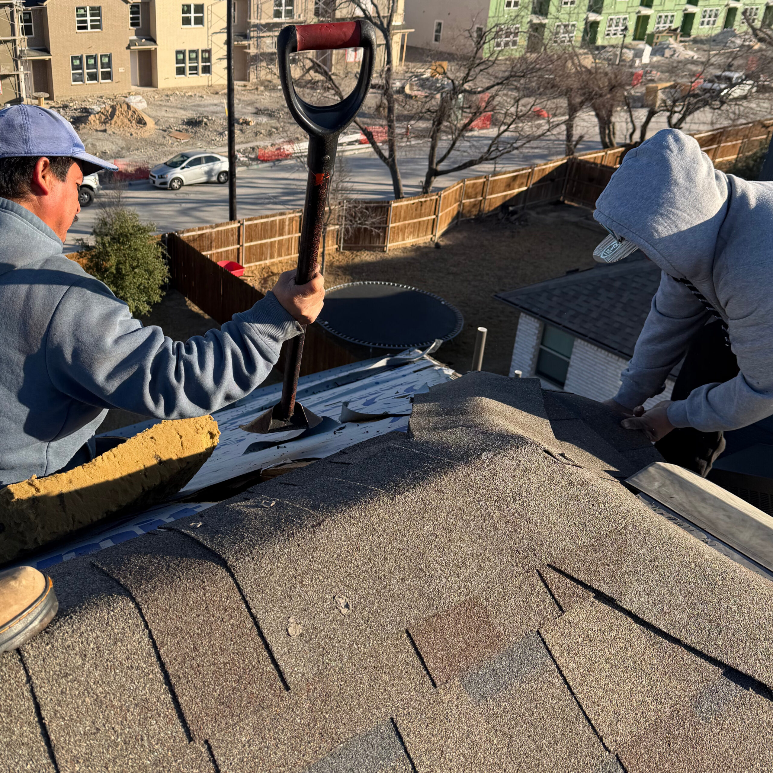 Rapid pro roofing team on a roof working in Dallas area
